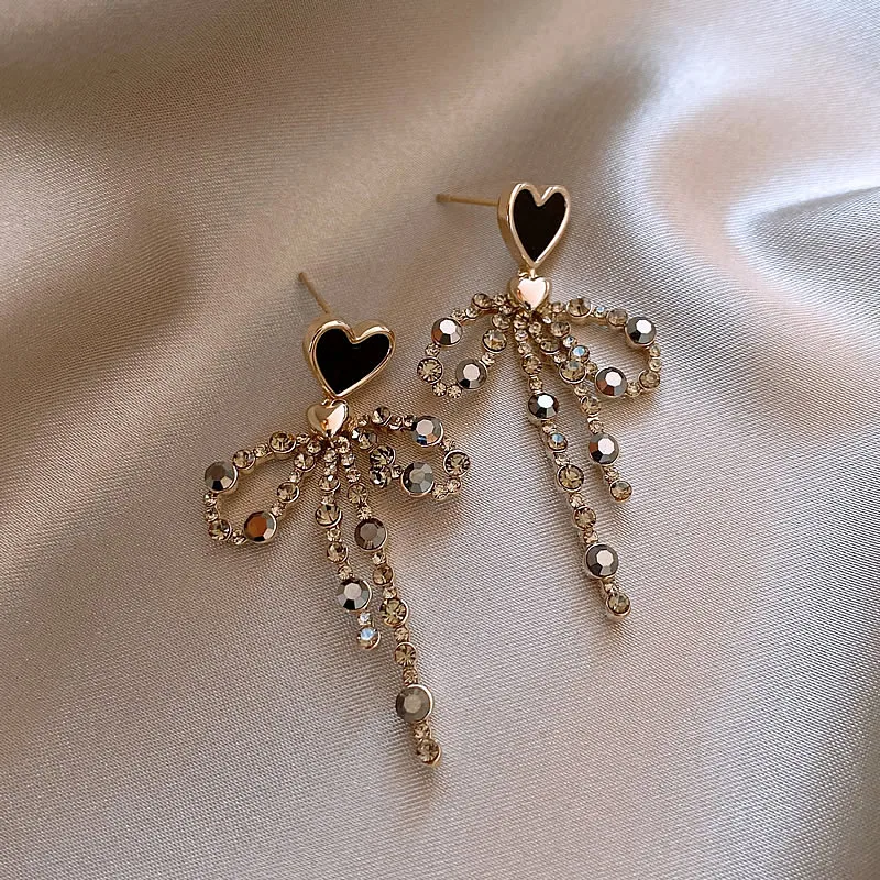 Elegant Zirconia Dangling Bow Heart