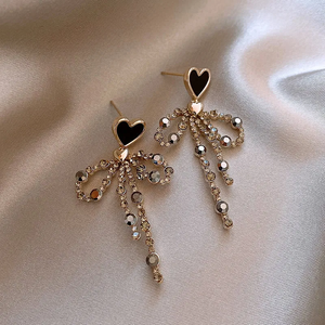 Elegant Zirconia Dangling Bow Heart